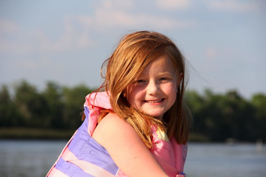 family charter guest redhead girl wearing life preserver