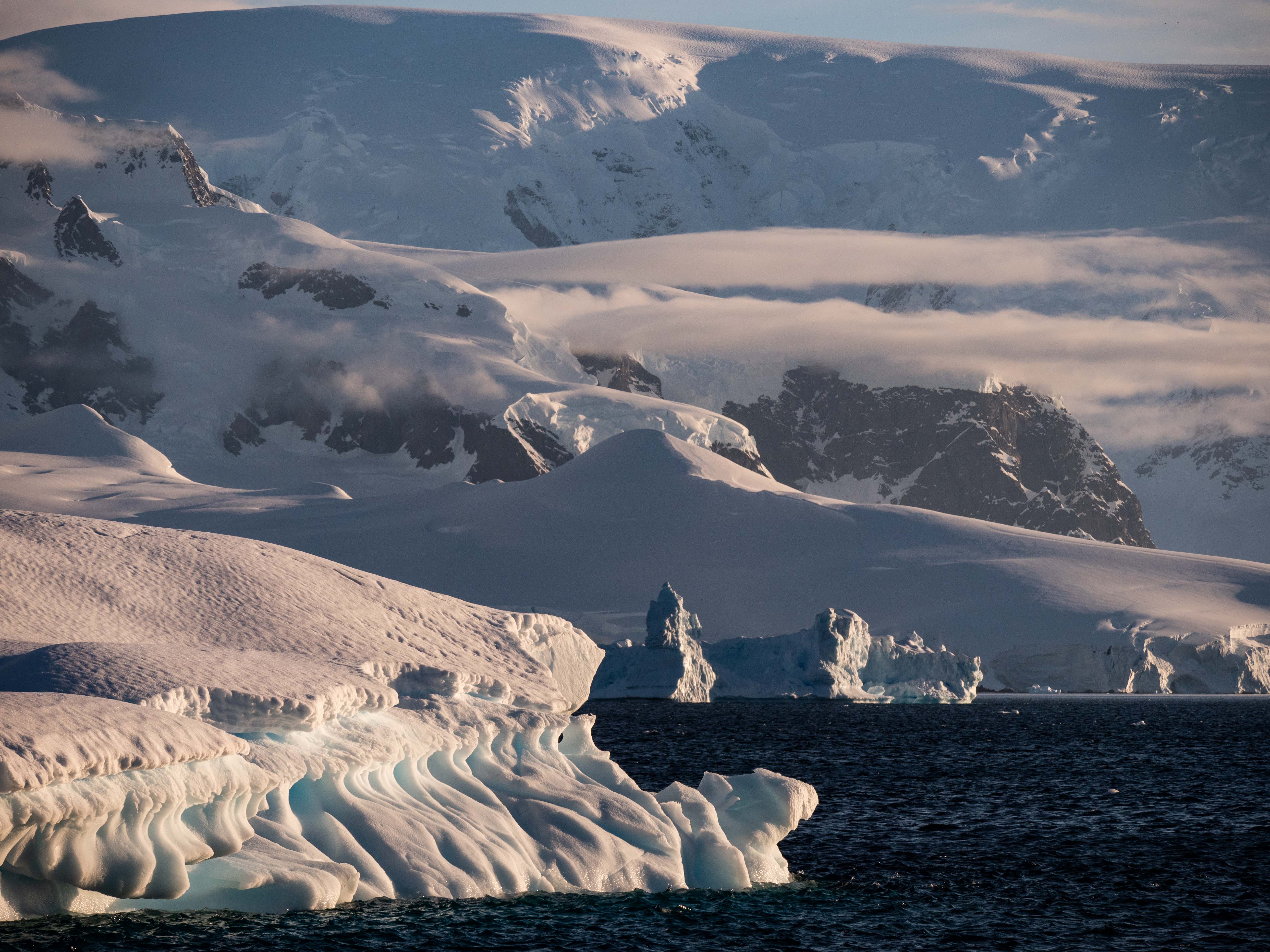 Antarctica snowy glaciers and ice bergs