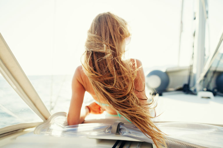 hair blowing in the wind on sailing yacht